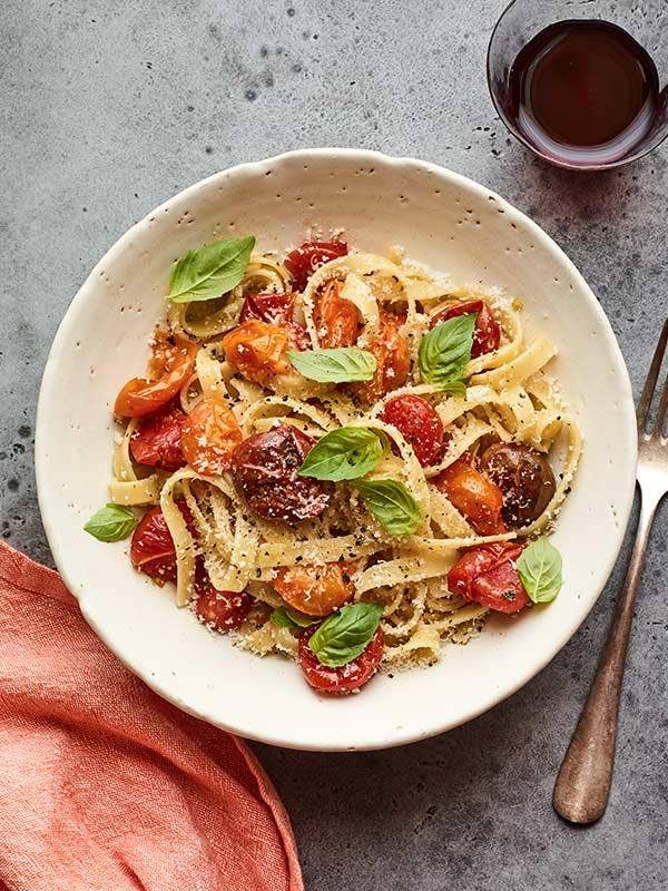 Smashed tomato pasta on plate.