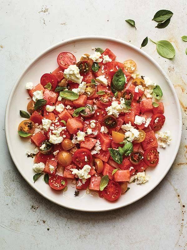 A plate of watermelon salad on a table.