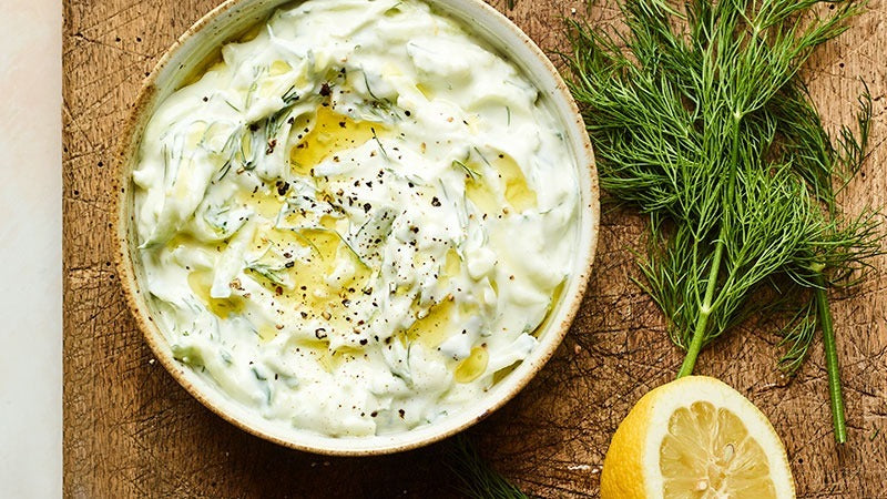 A bowl of tzatiki on table.