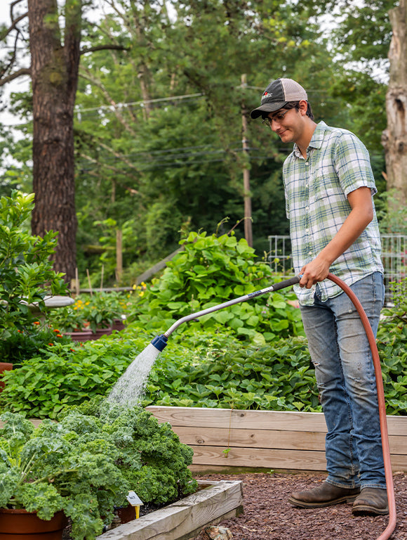 gardener watering his garden