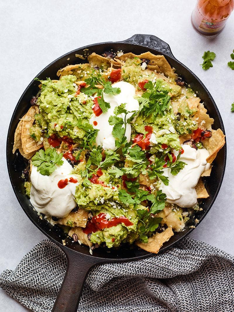 Veggie nachos in a skillet.